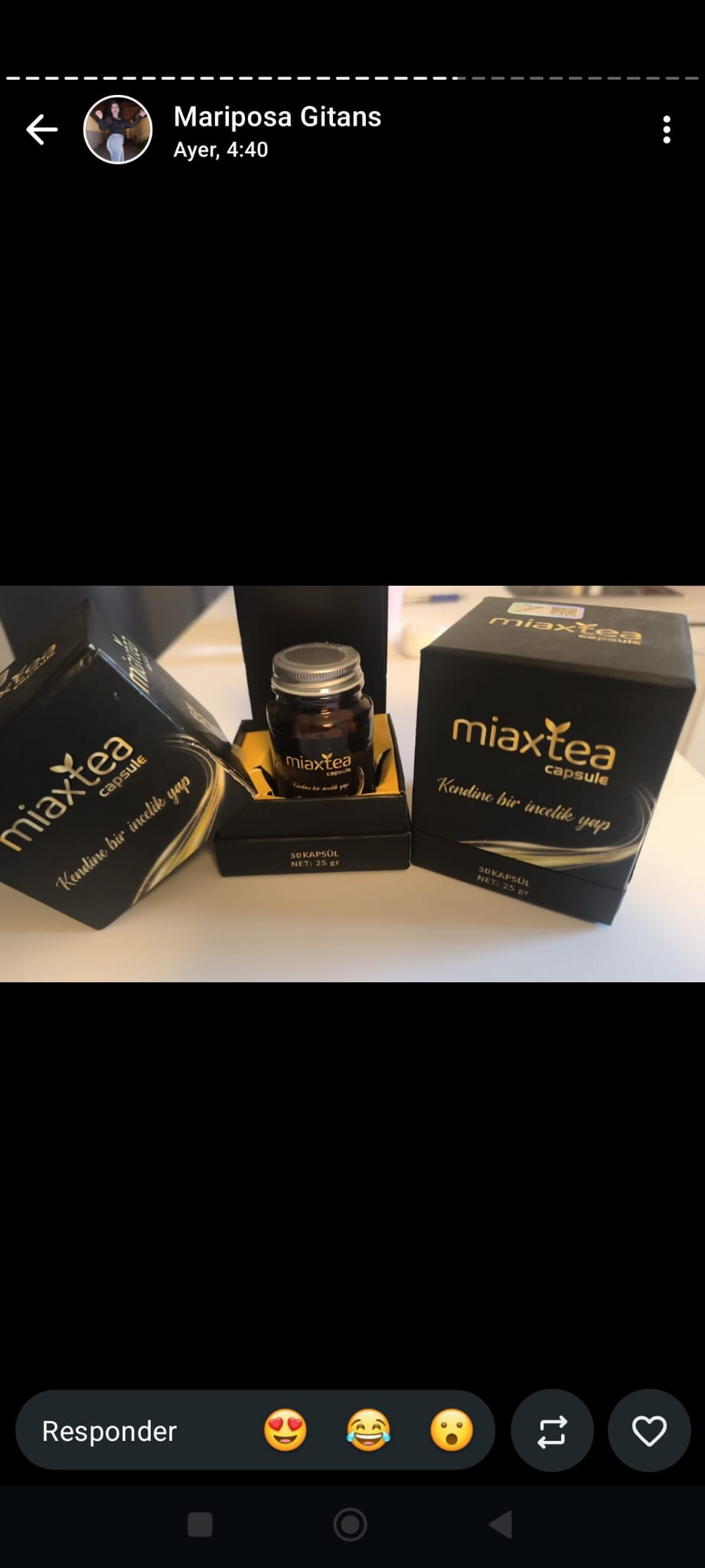 Cajas negras de MiaxTea cápsulas con el bote abierto